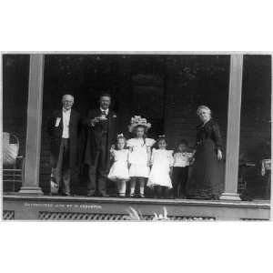   holding cup,saucer,older man,woman,four children,c1902