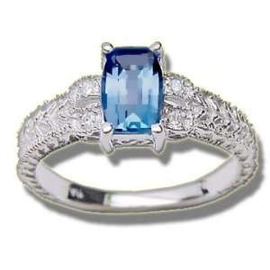    .04 ct 7X5mm Barrell Cut Blue Topaz Ladies White Ring: Jewelry