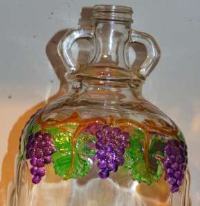 This is an original vintage clear glass Wine Jug or Bottle. Measuring 